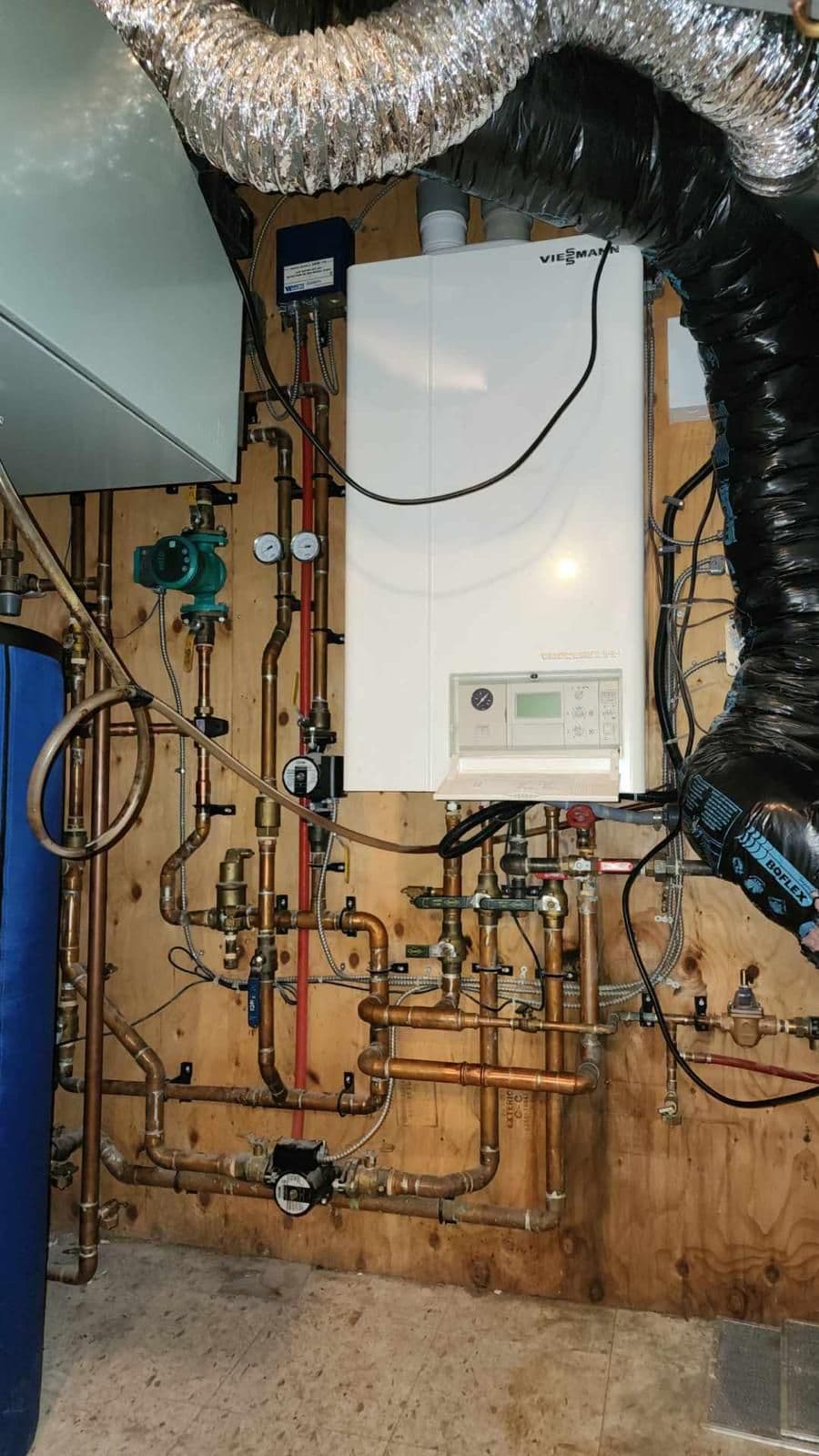 Viessmann boiler with new manifold and zoning piping installed in a basement mechanical room