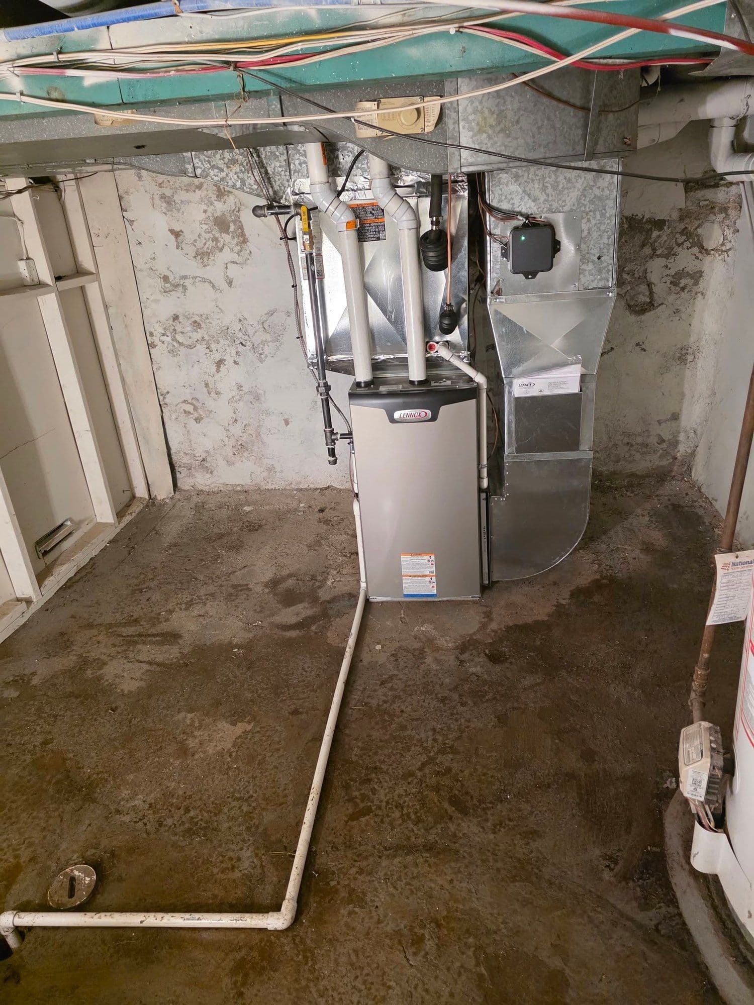 High-efficiency two-stage furnace freshly installed in a Niagara home utility room